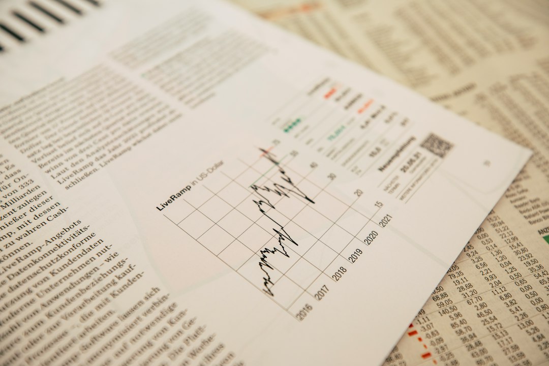 The VistaForge studio table covered with printed chart drafts and markers